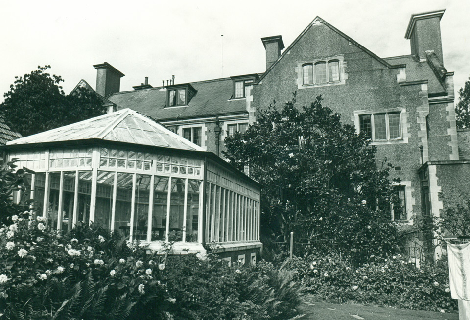 The original Glasshouse 1988, prior to demolition, house in background (Otago Daily Times, Dunedin).